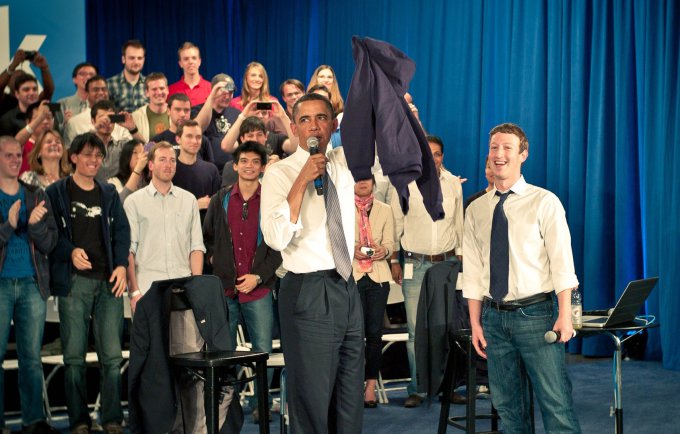 Zuckerberg leads a town hall meeting at Facebook's headquarters with President Obama in 2011